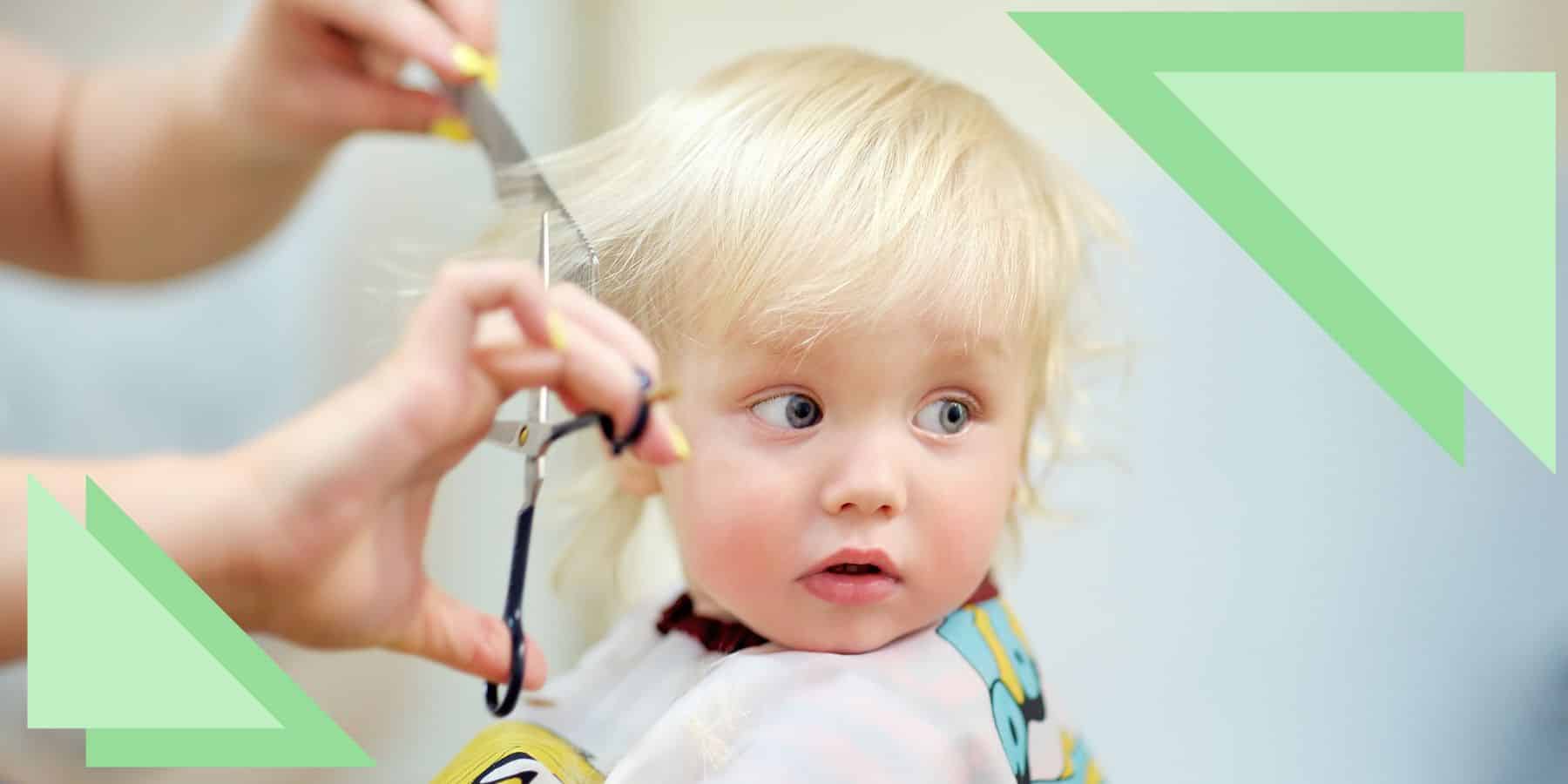 A toddler getting their hair cut with wide eyes, as if worrying their hair was cut too short.