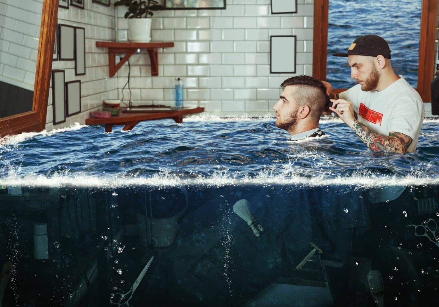 Man seated in a barbershop chair is getting his hair cut by a barber. Meanwhile, they’re surrounded by water from a flooded salon. A barbershop with this much standing water would face serious mold growth signs of water damage in the walls.